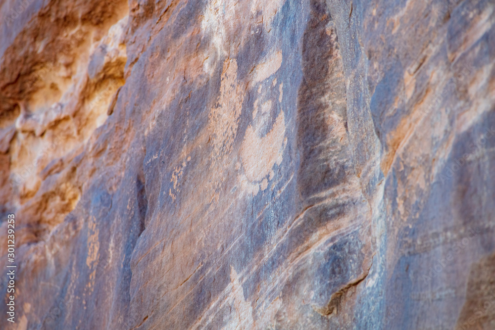 Detail of a part of the petroglyphs incised by the Fremont People in the sandstone rock face at Dinosaur National Monument, Utah