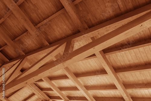 Fototapeta Naklejka Na Ścianę i Meble -  The construction of a wooden roof made of timber.