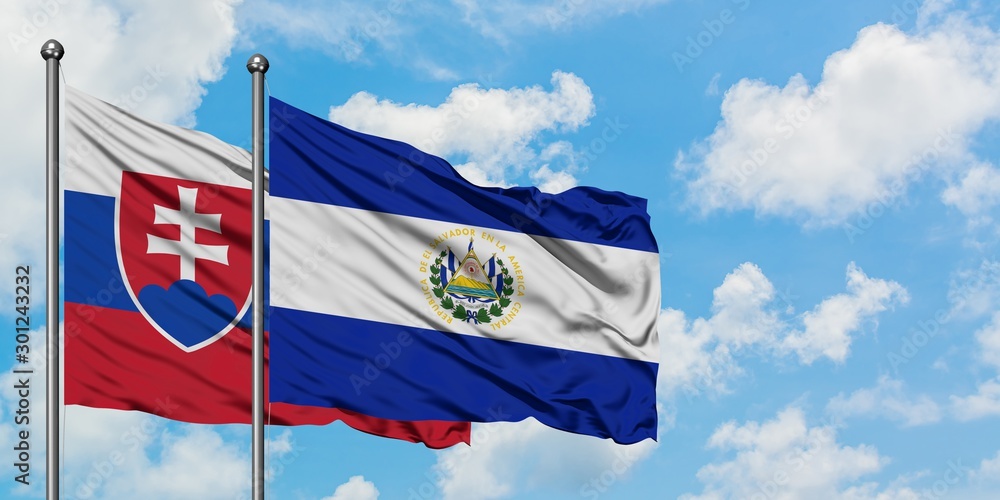 Slovakia and El Salvador flag waving in the wind against white cloudy blue sky together. Diplomacy concept, international relations. - obrazy, fototapety, plakaty 