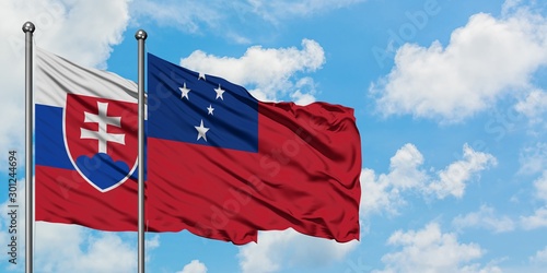 Photography Slovakia and Samoa flag waving in the wind against white cloudy blue sky together