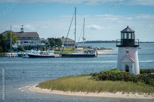 Hyannis harbor lighthouse on autumn day photo