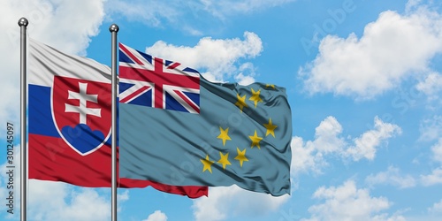 Canvas Print Slovakia and Tuvalu flag waving in the wind against white cloudy blue sky together