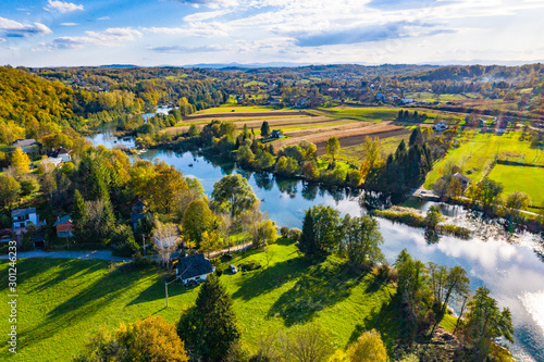 Panoramic view of Mreznica river in autumn from drone  green landscape and waterfalls  Croatia  popular touristic destination