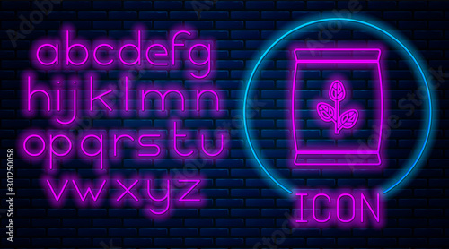 Glowing neon Fertilizer bag icon isolated on brick wall background. Neon light alphabet. Vector Illustration