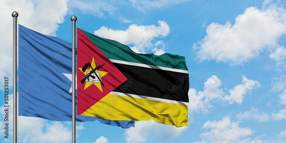 Somalia and Mozambique flag waving in the wind against white cloudy blue sky together. Diplomacy concept, international relations. Somalia and Mozambique flag waving in the wind against white cloudy blue sky together. Diplomacy concept, international relations.