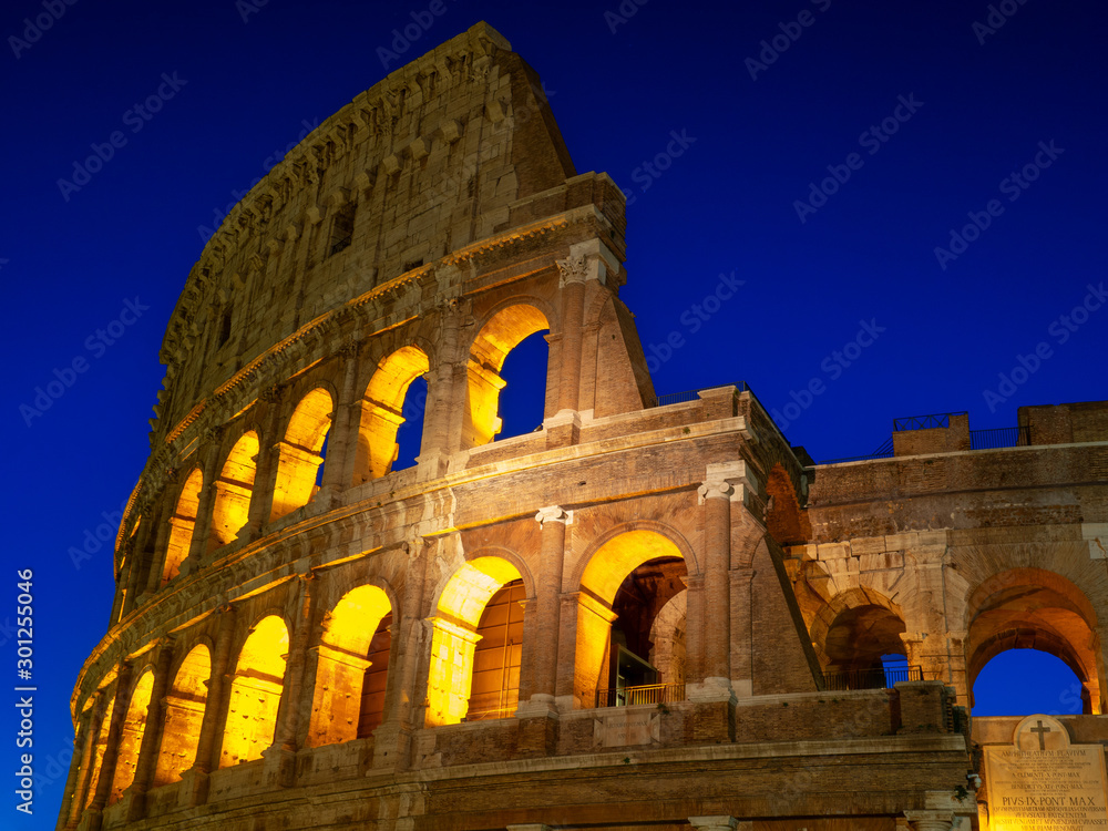 Fototapeta premium Night view of Colosseum in Rome, Italy. Rome architecture and landmark. Rome Colosseum is one of the main attractions of Rome and Italy