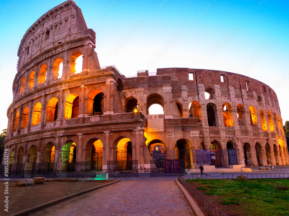 Fototapeta premium Night view of Colosseum in Rome, Italy. Rome architecture and landmark. Rome Colosseum is one of the main attractions of Rome and Italy