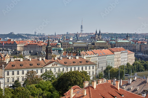 View of the roofs of red tiles and other buildings in Prague, the Czech Republic.