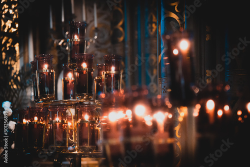 DUBLIN, IRELAND, DECEMBER 21, 2018: Beautiful bokeh of candles illuminating the interior of John's Lane Church.