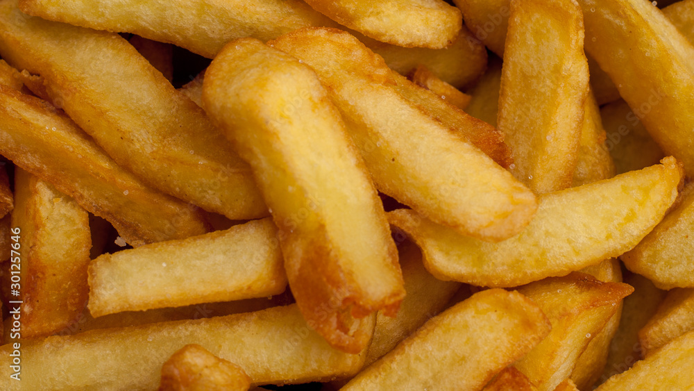 Close up of the golden coloured French fries. Close up of the golden coloured French fries.