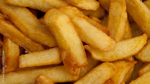 Close up of the golden coloured French fries.