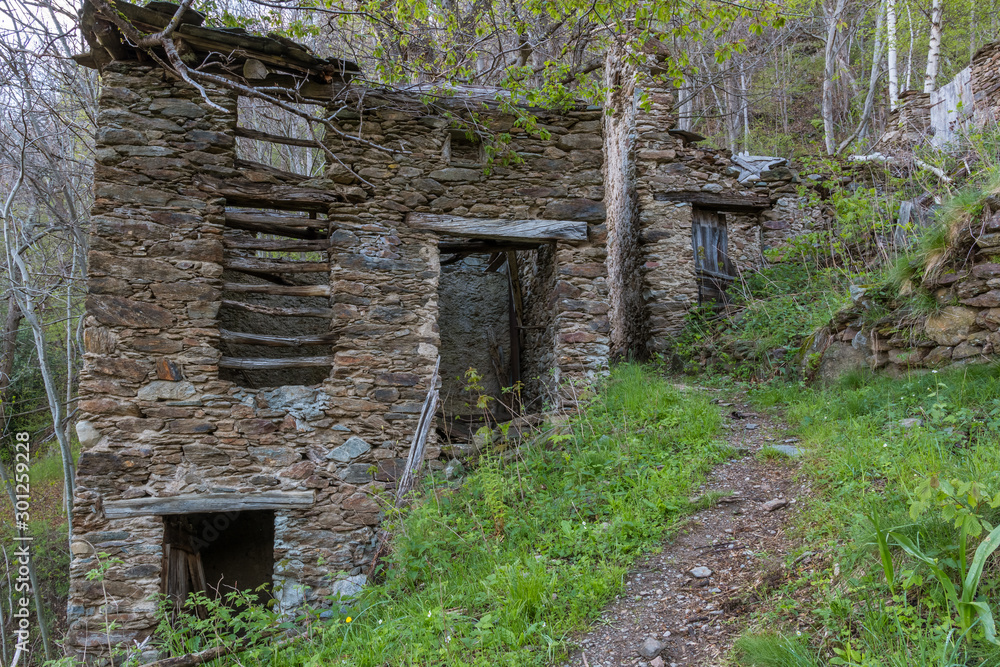 Abandoned ruins of the old village Camaggiore in Italian alps above the Lago di como Abandoned ruins of the old village Camaggiore in Italian alps above the Lago di como