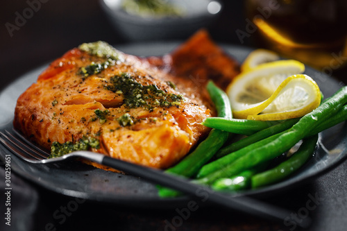 Canvas Print Closeup of baked salmon fish with green beans