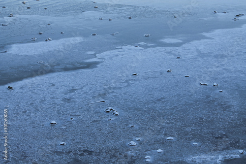 Winter sea. Patterns of ice on the water. View from above.