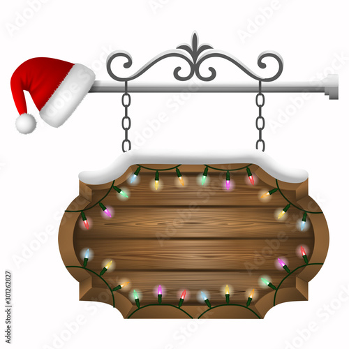 christmas wooden sign board with snow, colorful lights and santa claus hat