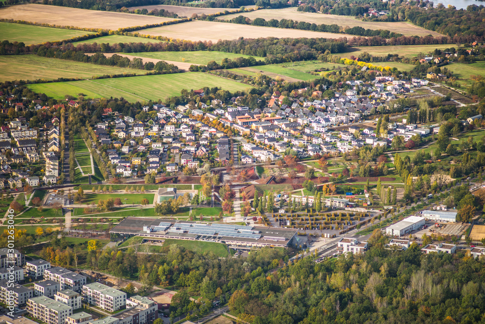 Potsdam, Germany, Volkspark Potsdam with the biosphere and suburb Bornstedt during early autumn - aerial view