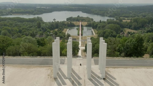 Modern architectural complex Axe Majeur on the Oise River in city of Cergy , France. Aerial shot of twelve columns de Saint-Christophe and bridge with red arches. photo