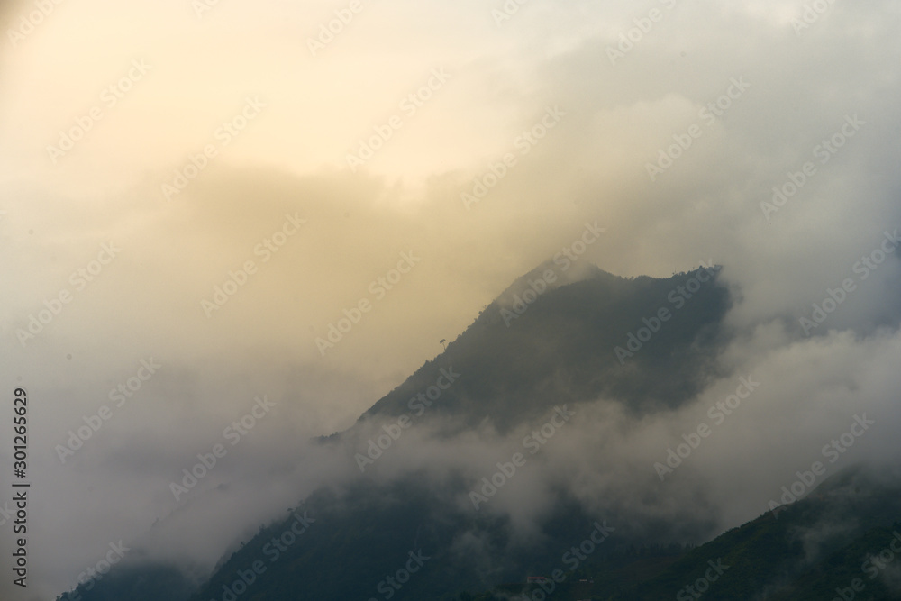 Beautiful landscape images of Sapa at sunrise and the surrounding mountains with their peaks poking out of clouds