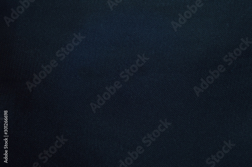 Minimal black silk bed sheet background (macro)