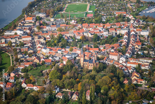 Island of the core city (main) Werder (Havel),  Germany,  with Heilig-Geist-Kirche (Holy Spirit Church) during early autumn - aerial view photo