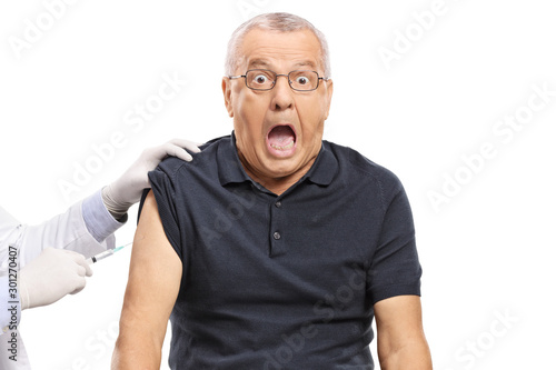 Scared mature man getting a vaccine