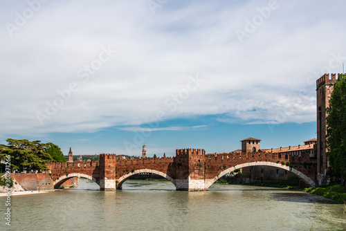 Medieval bridge made of bricks over river in Verona