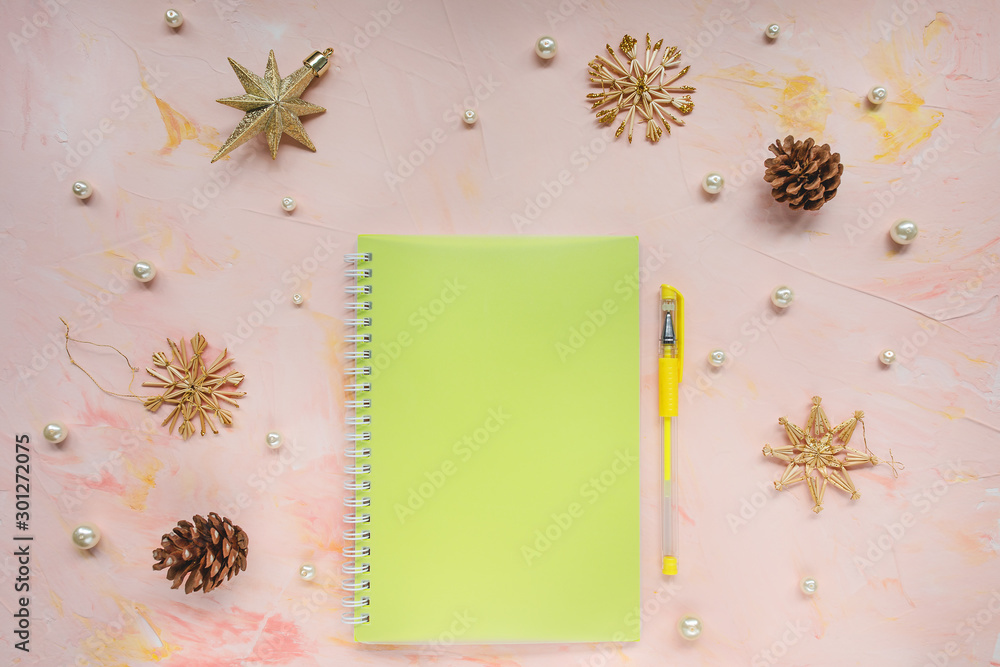 Notepad and pen on a desk workspace, winter template Notepad and pen on a desk workspace, winter template