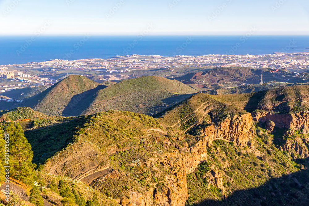 Volcanic landscape of Caldera de Bandama, Gran Canaria island, Spain. Panoramic view from Pico de Bandama. Atlantic ocean on the background