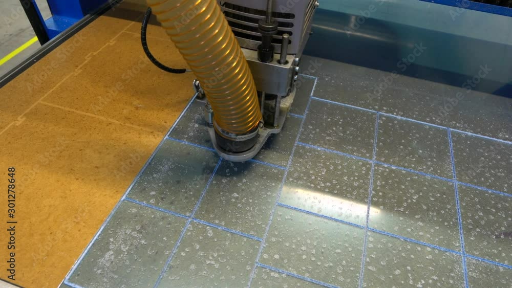 Milling cutter cuts plastic part on robotized production line. Factory robots used to produce precise an strict product on automation conveyor lines. Milling cutter cuts plastic part on robotized production line. Factory robots used to produce precise an strict product on automation conveyor lines.