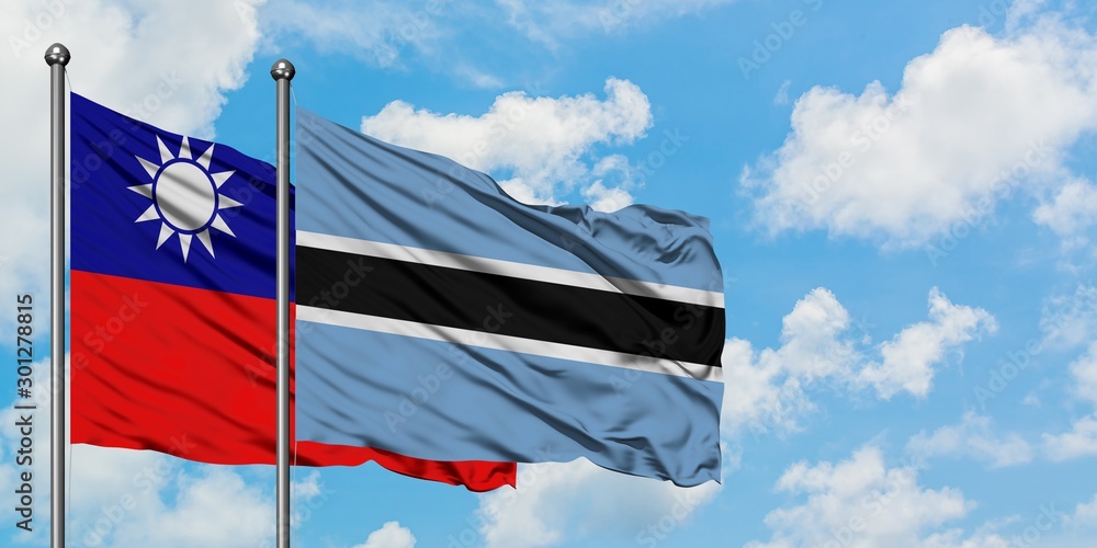 Taiwan and Botswana flag waving in the wind against white cloudy blue sky together. Diplomacy concept, international relations.