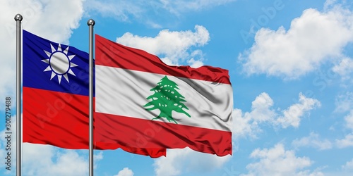 Taiwan and Lebanon flag waving in the wind against white cloudy blue sky together. Diplomacy concept, international relations.