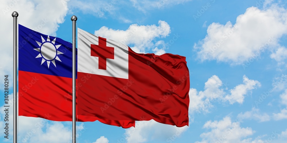 Naklejka premium Taiwan and Tonga flag waving in the wind against white cloudy blue sky together. Diplomacy concept, international relations.