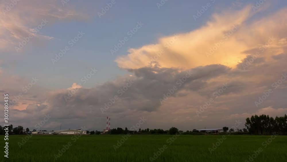 Beautiful sunset time lapse over green rice terraces with running clouds in Sisaket province Thailand,Asia. Beautiful sunset time lapse over green rice terraces with running clouds in Sisaket province Thailand,Asia.