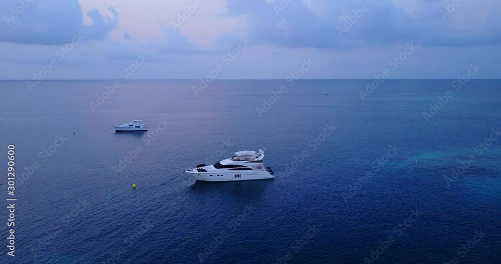 yachts docked in the ocean, wealthy people boat, motorboats for a luxury vacation retreat yachts docked in the ocean, wealthy people boat, motorboats for a luxury vacation retreat