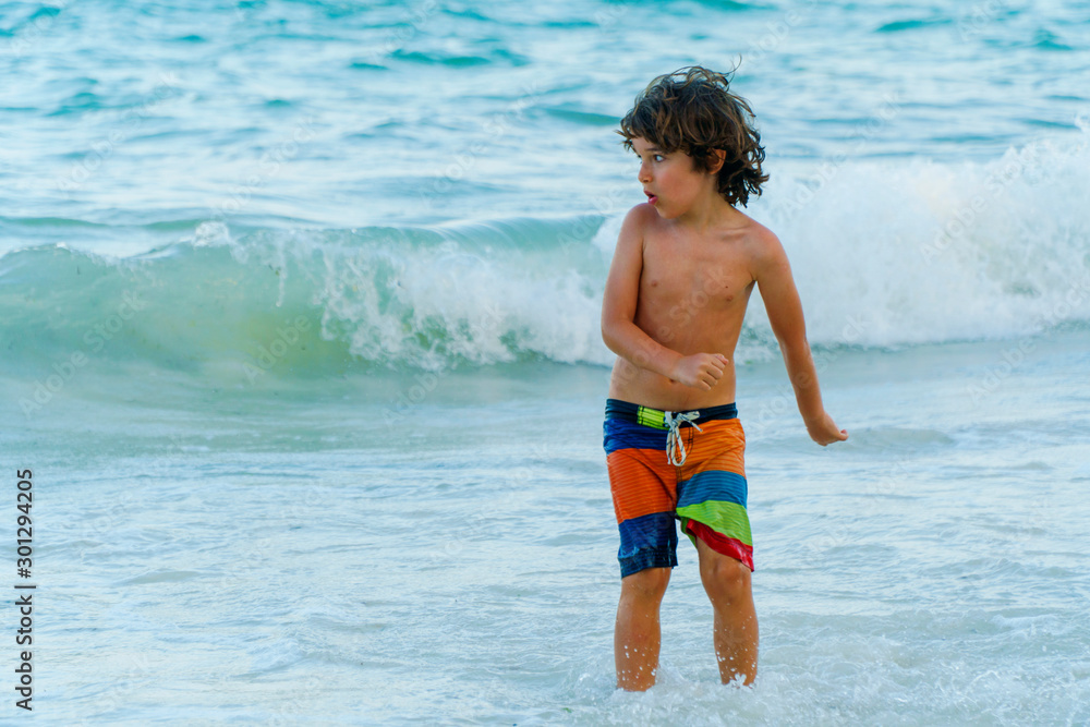 child  having fun in vacation at the ocean