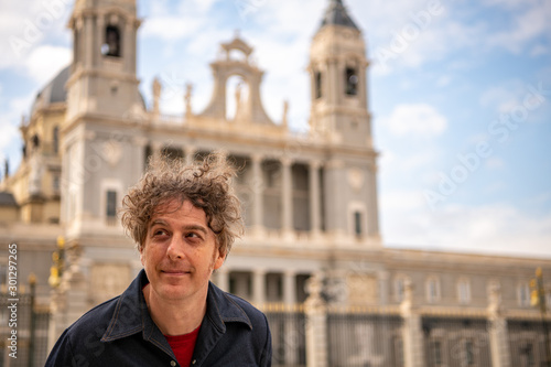 A man travels in Spain, visiting the Cathedral Almudena in Madrid.