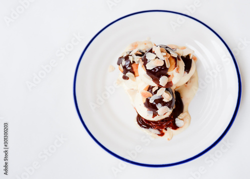 Choux pastry with vanilla ice cream and hot chocolate sauce