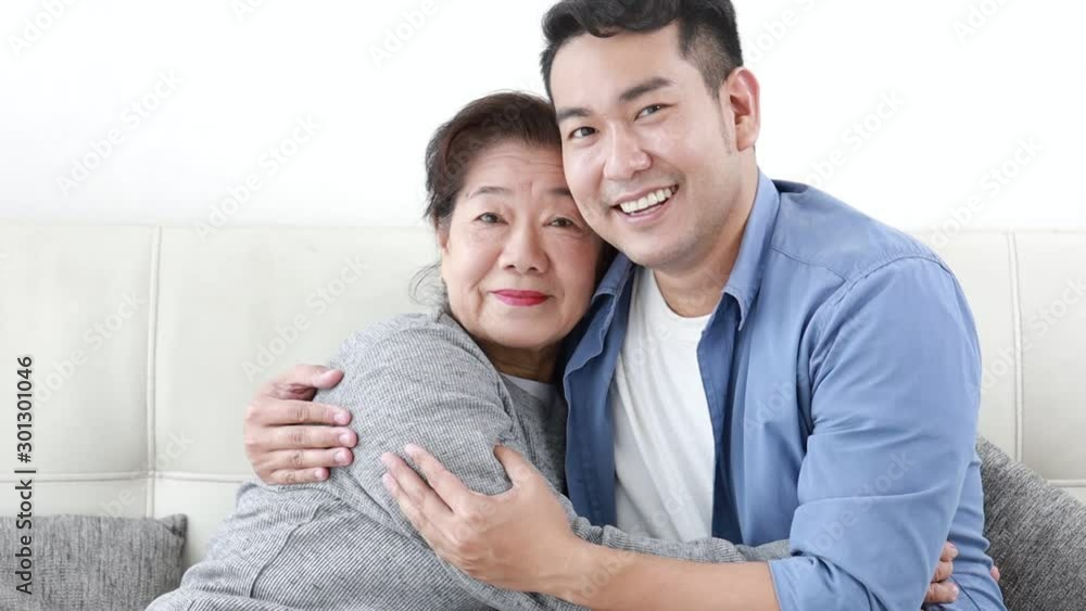 Asian mother and son lifestyle in living room Asian mother and son lifestyle in living room