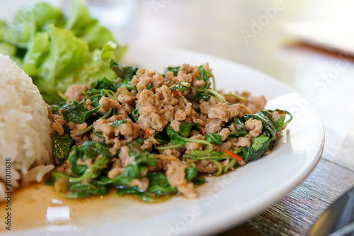 Selective focus of Rice with stir-fried chicken and basil,Most popular of Thai's steet food.