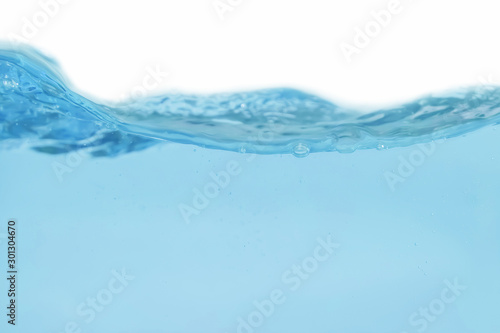 Water splash and air bubbles isolated over white background. Blue water wave hydrate abstract art and splash craft are drop, liquid bubble flow fresh and splashing for copy space text World Water Day.