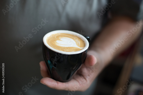 barista made latte art for customer