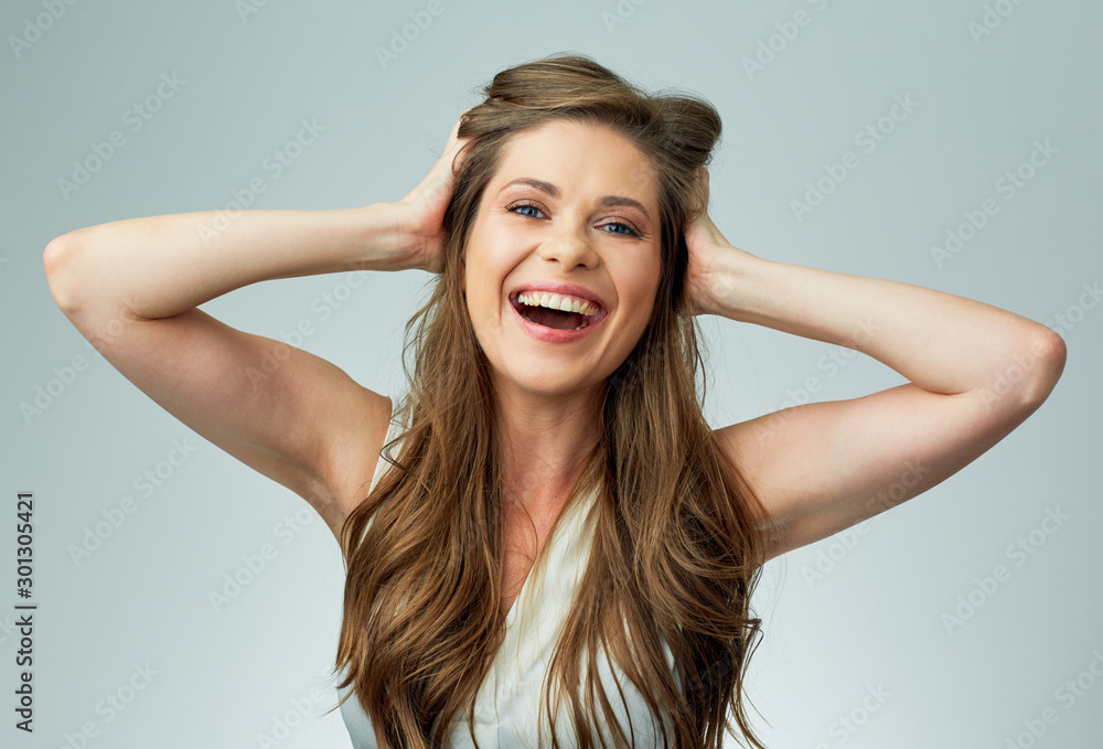 Fototapeta premium happy woman touching long hair.