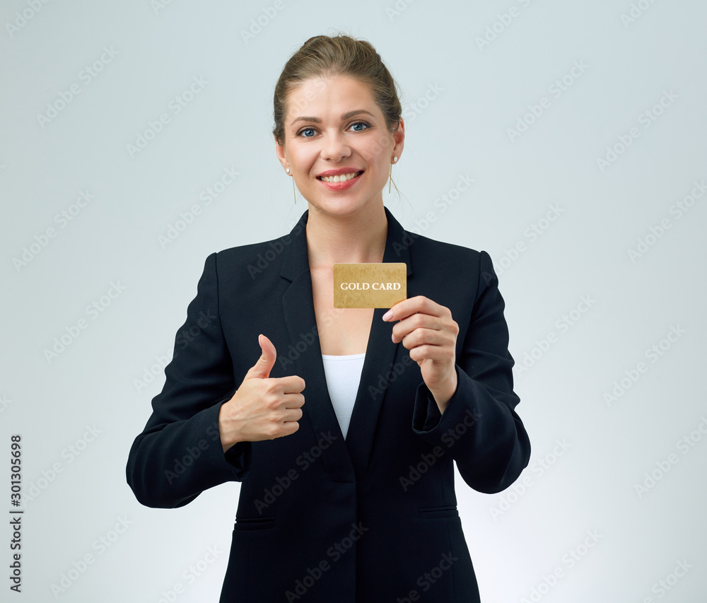Smiling woman holding credit card and show thumb up Smiling woman holding credit card and show thumb up