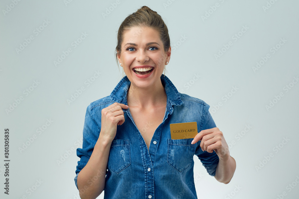 woman in casual denim shirt holding credit card woman in casual denim shirt holding credit card