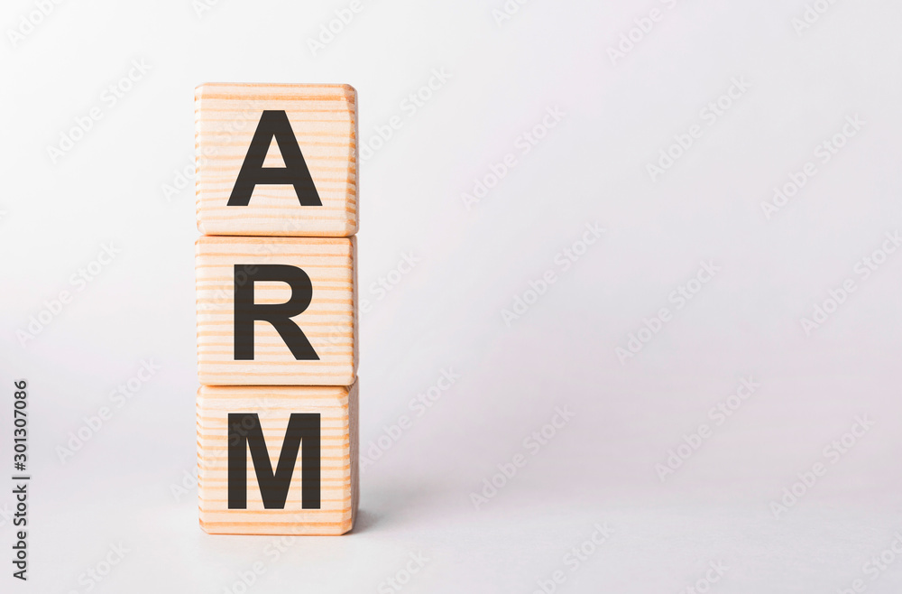 ARM letters of wooden blocks in pillar form on white background, copy space ARM letters of wooden blocks in pillar form on white background, copy space