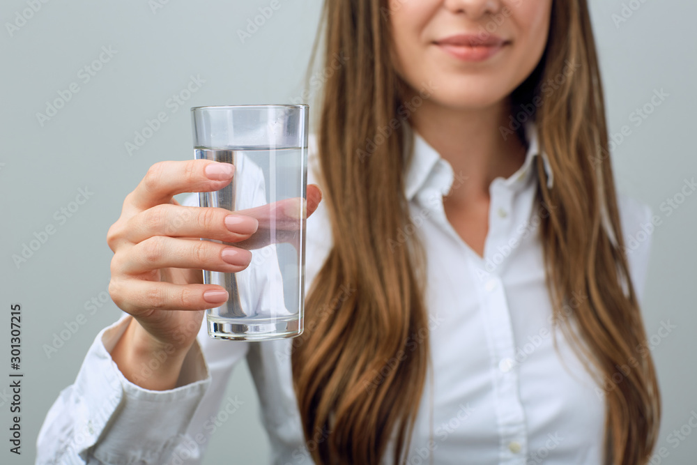 Close up half face portrait of woman with water glass. Close up half face portrait of woman with water glass.