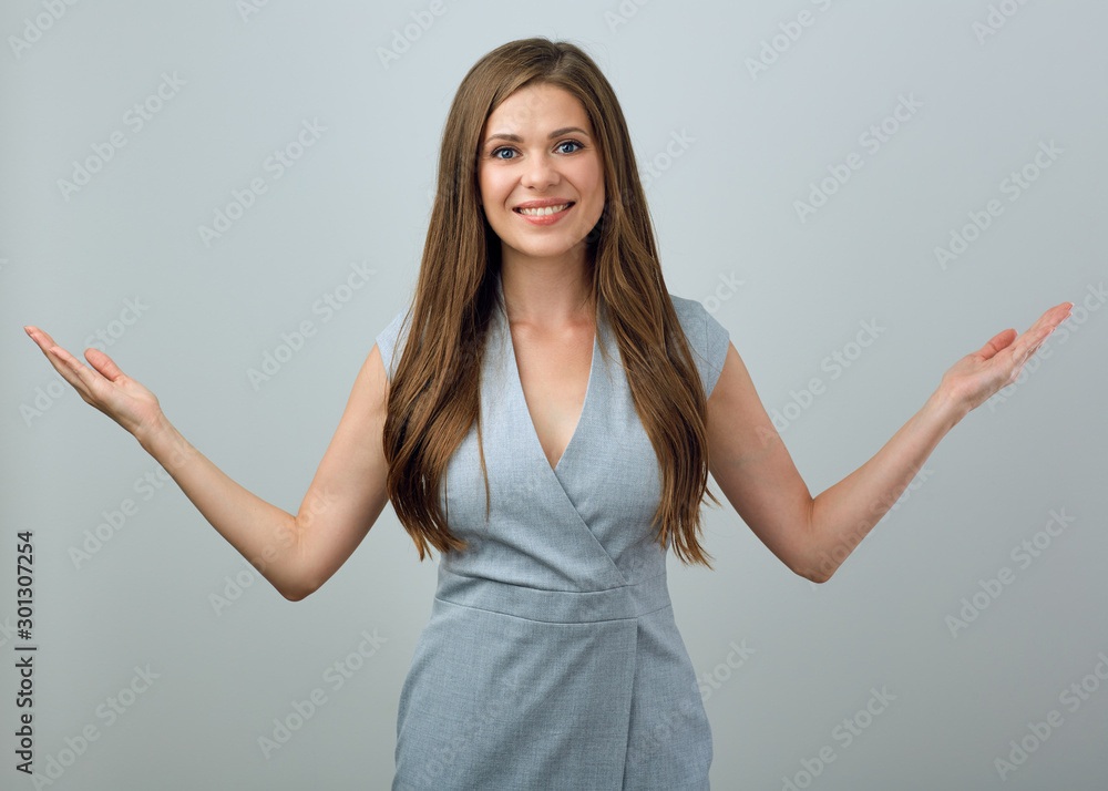 Smiling girl gesturing with two hands. Smiling girl gesturing with two hands.