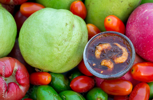 Raw mango slice with sweet dried shrimp sauce, Mango and Guava with sweet fish sauce is a delicious menu. Ancient thai food mango sweet fish sauce Street food in thailand