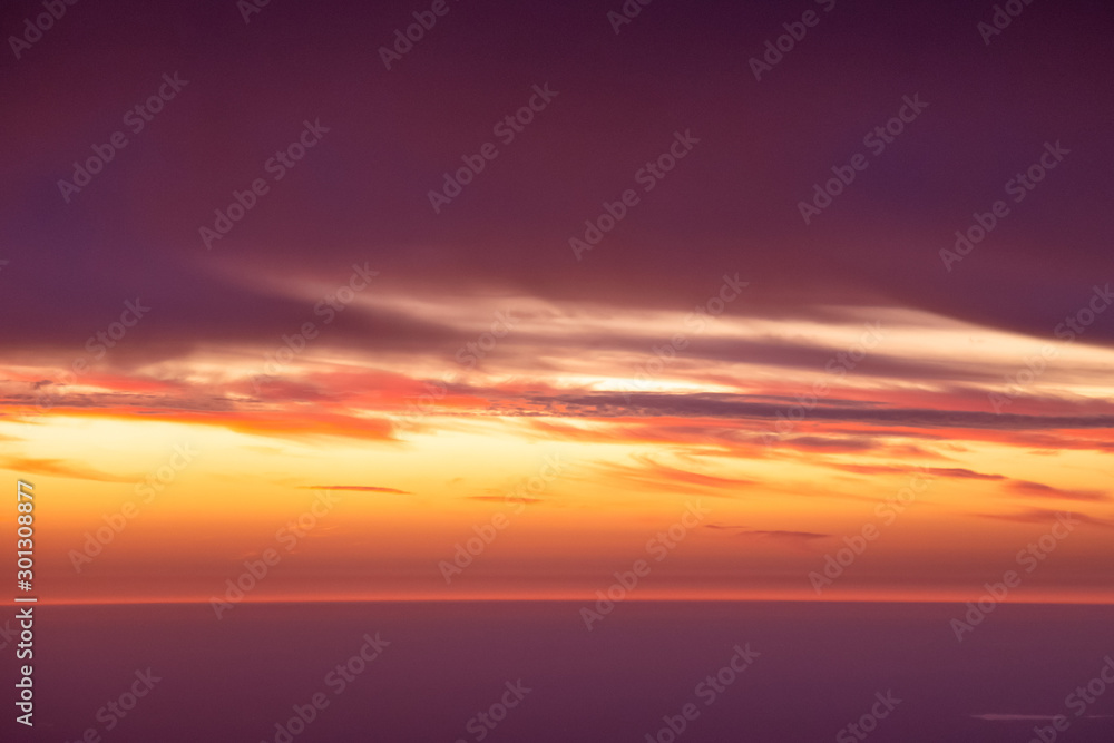 Aerial view of sunset and clouds in the sky.