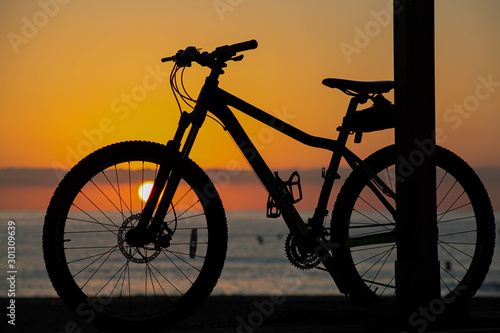 The Bike down on The Beach at Sun Rise